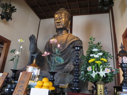 This is the Asuka Daibutsu. While much smaller than the Daibutsu in the Todaiji, it is much older (built in the early seventh century). Also unlike the Todaiji Daibutsu, this one is the same statue. It has never been broken or repaired. The guide told us all about this statue and said that it has been in the exact same location for over 1000 years! The building hasn't always been there and so for a time the Great Buddha was battered by the elements, but it has always been worshiped.